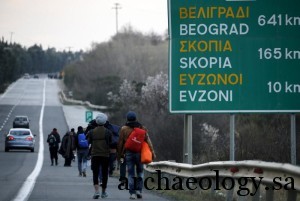 Stranded refugees walk through a national motorway towards the Greek-Macedonian border, February 25, 2016. REUTERS/Yannis Behrakis