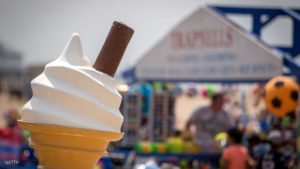 WESTON-SUPER-MARE, ENGLAND - JUNE 11: The sun illuminates a promotional ice cream cone outside a beachside shop as visitors enjoy the fine weather on June 11, 2015 in Weston-Super-Mare, England. Many traditional British seaside resorts are gearing up for the summer season and will be hoping that the traditional attractions offered will help keep visitor numbers up. (Photo by Matt Cardy/Getty Images)